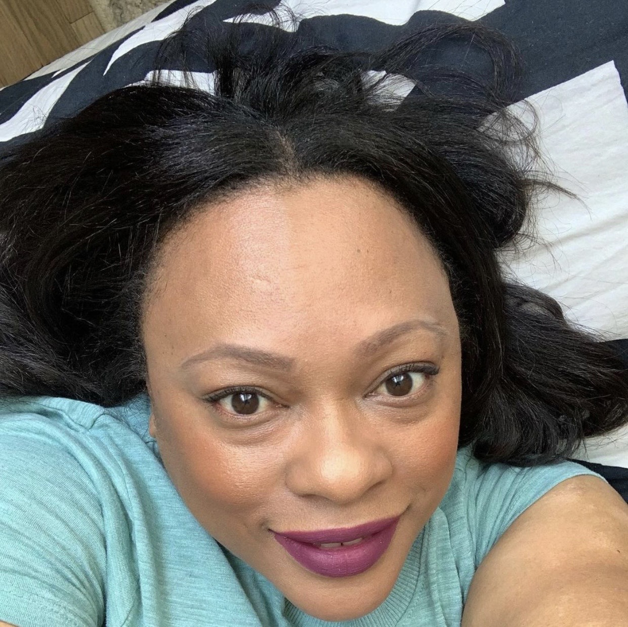 Customer wearing Enticing plum matte lipstick