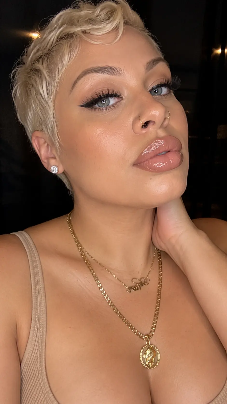 Platinum pixie portrait with glossy nude lips