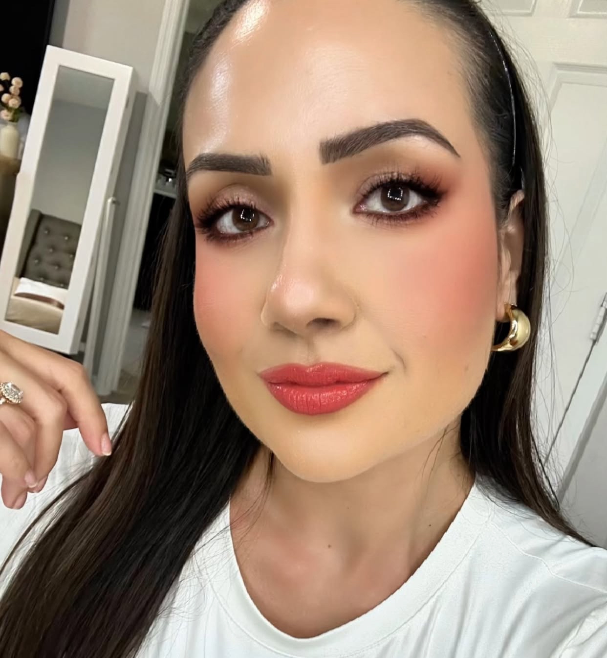 Baddie — warm coral-red matte lipstick