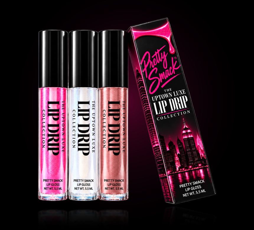 The Uptown Luxe Lip Drip collection box with three gloss tubes in shimmering hot pink, iridescent sheer and rose bronze