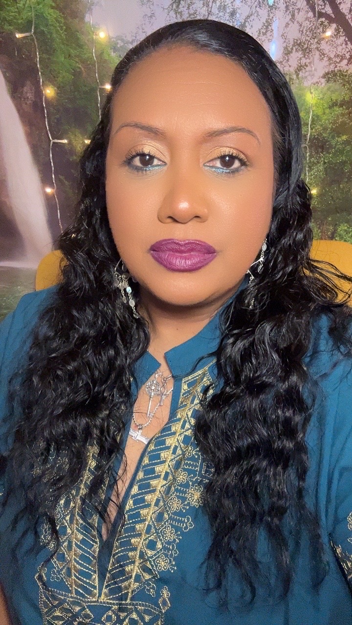Customer wearing Enticing berry-plum matte lipstick